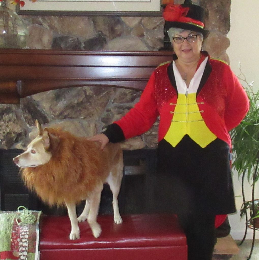 Guest dressed up as circus ringleader with dog dressed up as a lion