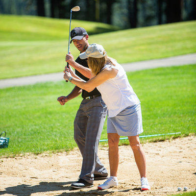 golfer receiving instruction